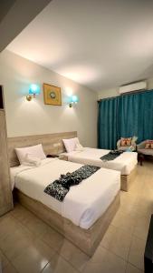 Postel nebo postele na pokoji v ubytování Nile Hotel