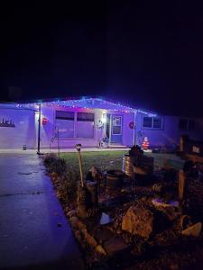 a house with lights on it at night at Roaring Fork Retreat home in Glenwood Springs