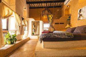 a bedroom with a bed in a room at Firefly boutique Hotel Zanzibar in Zanzibar City +215 photos