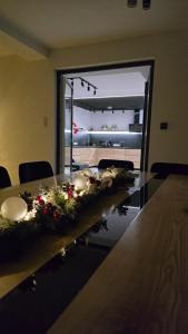 a dining room table with christmas decorations on it at Domki u Duszy Wielka Dusza in Brenna +24 photos