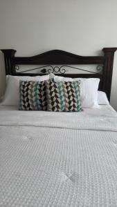 Postel nebo postele na pokoji v ubytování Aparthotel zona 9 + 6 fotografií