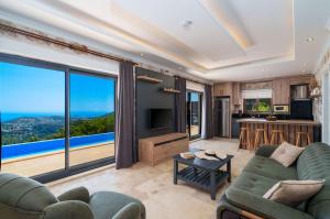 a living room with a view of the ocean at Villa Elvin in İslâmlar