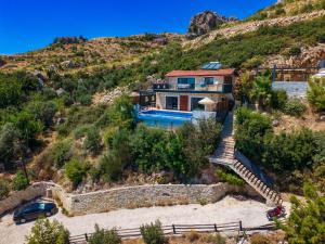 a house on a hill with a slide at Villa Elvin in İslâmlar