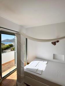 Postel nebo postele na pokoji v ubytování Niriedes Villas