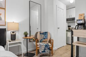 a living room with a chair and a table at Highly Recommended Studio Near Times Square in New York +6 photos