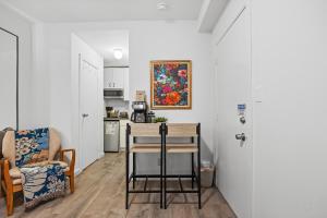 a kitchen with a table and a chair in a room at Highly Recommended Studio Near Times Square in New York