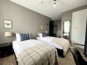 Postel nebo postele na pokoji v ubytování Hotel Leifur Eiriksson