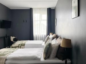 Postel nebo postele na pokoji v ubytování Hotel Leifur Eiriksson