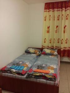 A bed or beds in a room at M+D Hotel