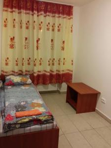 A bed or beds in a room at M+D Hotel