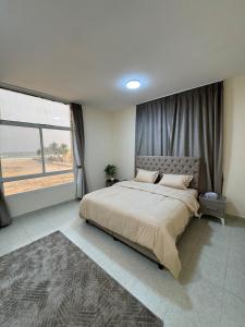 Una cama o camas en una habitación de The sea view apartment salalah 3 fotos más