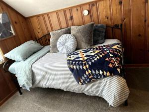 a bed in the corner of a room at Spacious 4BR Close to Airport for Work and Families in Columbus