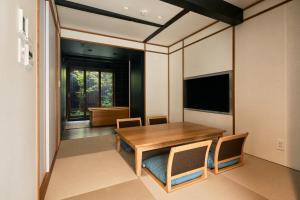 TV a/nebo společenská místnost v ubytování Kikuyu No Yado