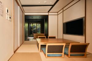 TV a/nebo společenská místnost v ubytování Kikuyu No Yado