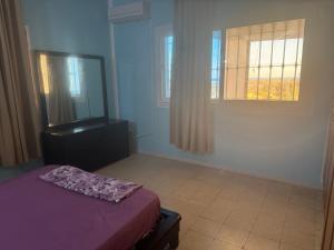 En eller flere senge i et værelse på Résidence Laguna