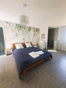 Кровать или кровати в номере La Noyeraie +7 фотографий