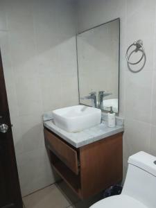 a bathroom with a sink and a mirror at casa ex hacienda casasano in Cuautla Morelos +8 photos