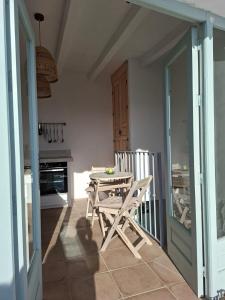 a dining room with a table and chairs in a room at Casa Luna Miel in Frigiliana +11 photos