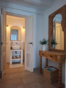 a bathroom with a sink and a mirror at Casa Luna Miel in Frigiliana