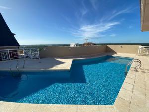 a swimming pool on the roof of a building at Tigre Centro A - piscina y seguridad 24hs - Opcional cochera paga in Tigre
