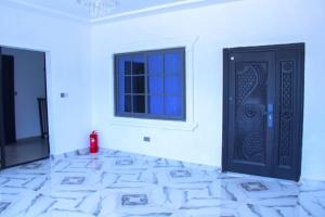 En eller flere senge i et værelse på Rych Lodge