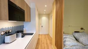 En eller flere senge i et værelse på Écume et Sérénité Parking Privé Wifi Clim et LIT en 140