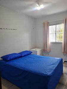 En eller flere senge i et værelse på APARTAMENTO EM ICARAÍ COM PISCINA 500mt DA PRAIA + 22 billeder