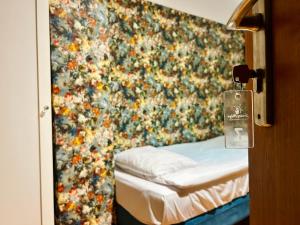 Ένα ή περισσότερα κρεβάτια σε δωμάτιο στο Stary Młyn