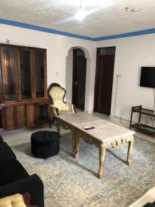 a living room with a coffee table and a couch at Blue Waves Apartments in Mombasa