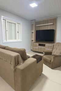 Φωτογραφία από το άλμπουμ του Casa com Quiosque e piscina! σε Capão da Canoa