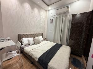 En eller flere senge i et værelse på Faaloon