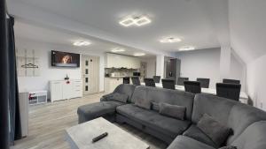 a living room with a couch and a table at Sunny Hill Cab in Bulz