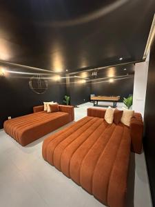 two beds in a room with a bench and a table at Luxury Villa Marrakech in Marrakesh +33 photos