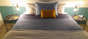 Postel nebo postele na pokoji v ubytování Kooglof Maison