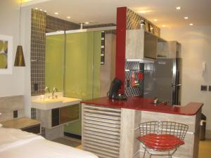 a room with a kitchen with a sink and a counter at Condo Prudente 108 in Rio de Janeiro