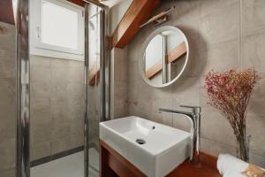 a bathroom with a sink and a mirror at Bianca Cappello House in Venice +126 photos