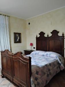 Ένα ή περισσότερα κρεβάτια σε δωμάτιο στο Il Gallo d' Oro - Scoiattolo