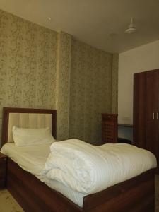 Ένα ή περισσότερα κρεβάτια σε δωμάτιο στο Hotel sarah palace