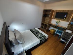 Postel nebo postele na pokoji v ubytování Hotel Casa Santiago