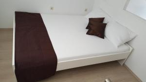 Postel nebo postele na pokoji v ubytování Apartments Rotim