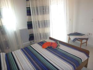 Postel nebo postele na pokoji v ubytování Villa Faidra