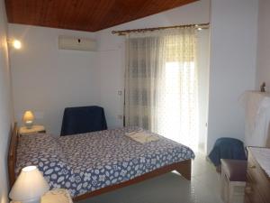 Postel nebo postele na pokoji v ubytování Villa Faidra