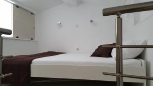 Postel nebo postele na pokoji v ubytování Apartments Rotim