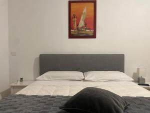 Ένα ή περισσότερα κρεβάτια σε δωμάτιο στο B&B Olimpia