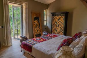 Postel nebo postele na pokoji v ubytování Cabaña Rincón de Piedra