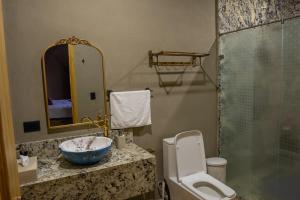 Koupelna v ubytování Cabaña Rincón de Piedra + 14 fotografií