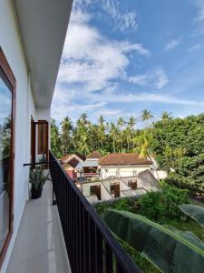 a balcony with a view of a resort at Lemon Tree Hotel Bali in Lovina