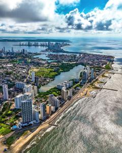 an aerial view of a city and the ocean at Apartaestudio Marbella #2-10 in Cartagena de Indias +2 photos