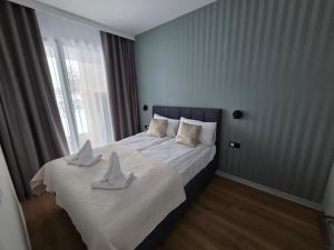 Ένα ή περισσότερα κρεβάτια σε δωμάτιο στο Omega Lake Family 2 +27 φωτογραφίες