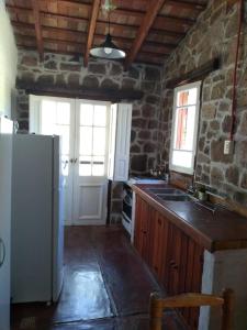 Kuchyň nebo kuchyňský kout v ubytování Valle Iguana